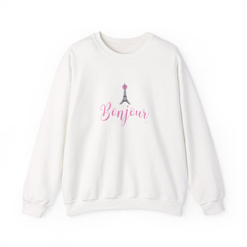 An off-white crewneck sweatshirt featuring a pink 'Bonjour' script and a small gray Eiffel Tower graphic on the chest, displayed against a clean white background.